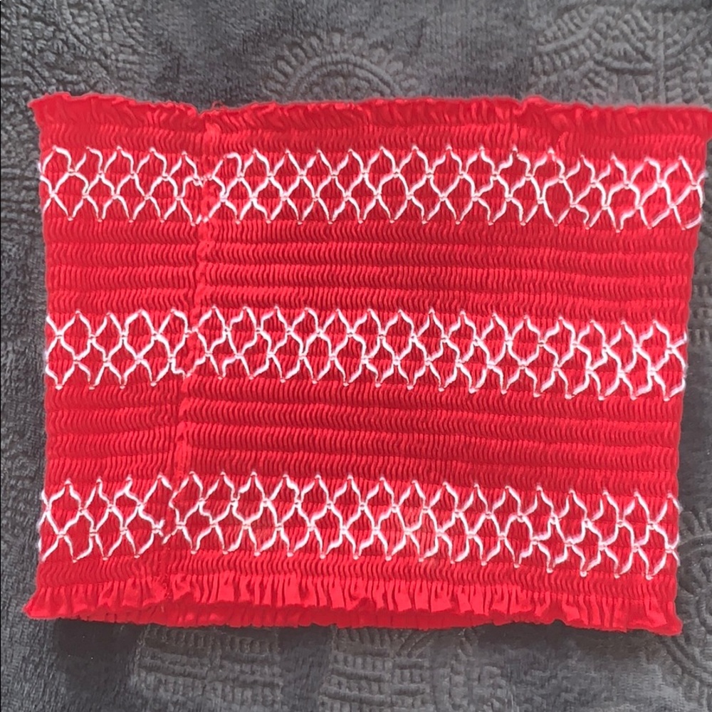 A red strapless tub top